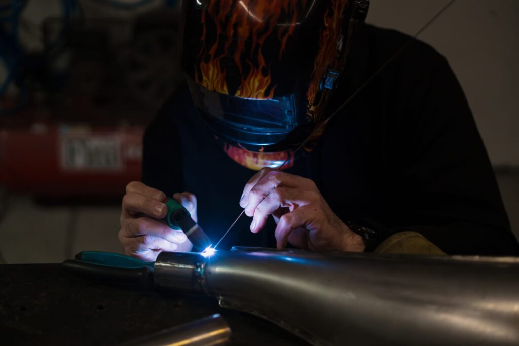 Beginner TIG welding setup with torch and filler rod technique